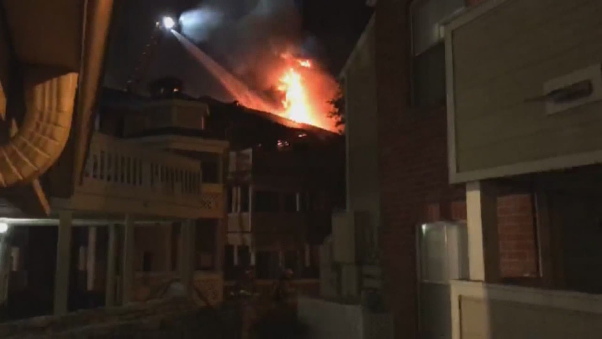 Flames tear through apartment complex