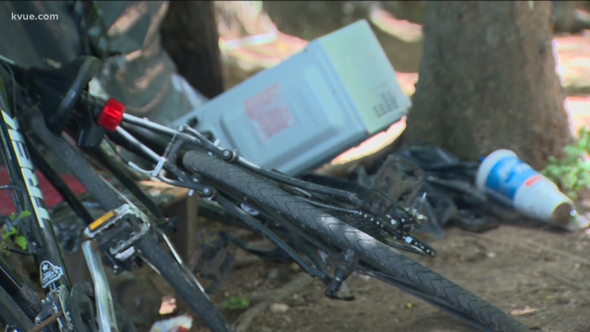 Police found more than a dozen stolen bikes in a homeless camp – one worth $6,000.