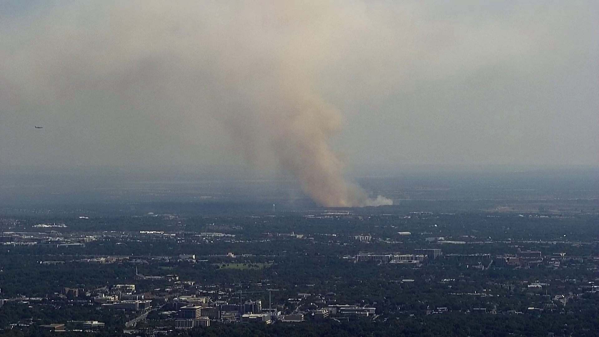 The fire is spreading toward structures in the area, according to Austin Fire officials.