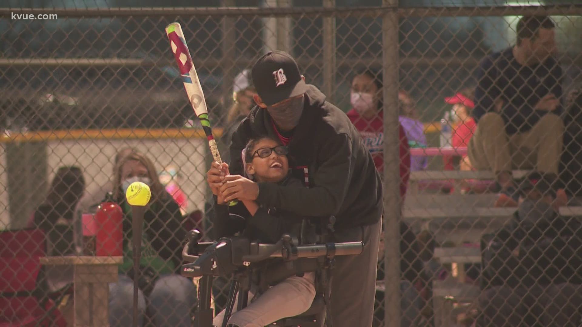 The 10-year-old may not be able to run or walk, but with the help of her brother, she's able to play her favorite game: baseball.