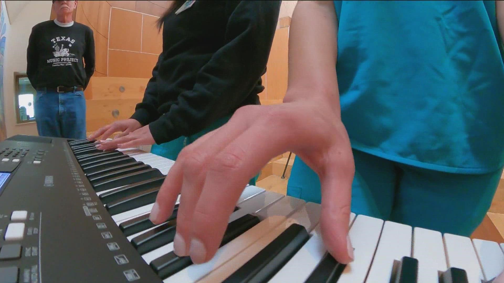 The piano, which will be used in the center's music therapy program, was donated by the Texas Music Project.