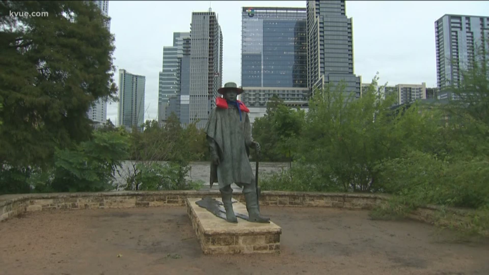 Austin police telling people to stay off trail near Lady Bird Lake. Someone put a life jacket on the Stevie Ray Vaughan statue as the area prepares for flooding.