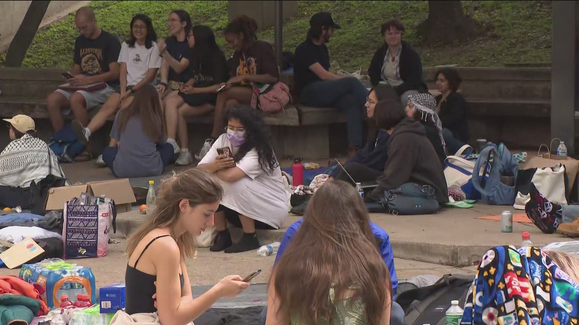 Protesters have gathered outside the Travis County Jail Tuesday morning, awaiting the release of nearly 80 demonstrators who were arrested at UT Austin on Monday.
