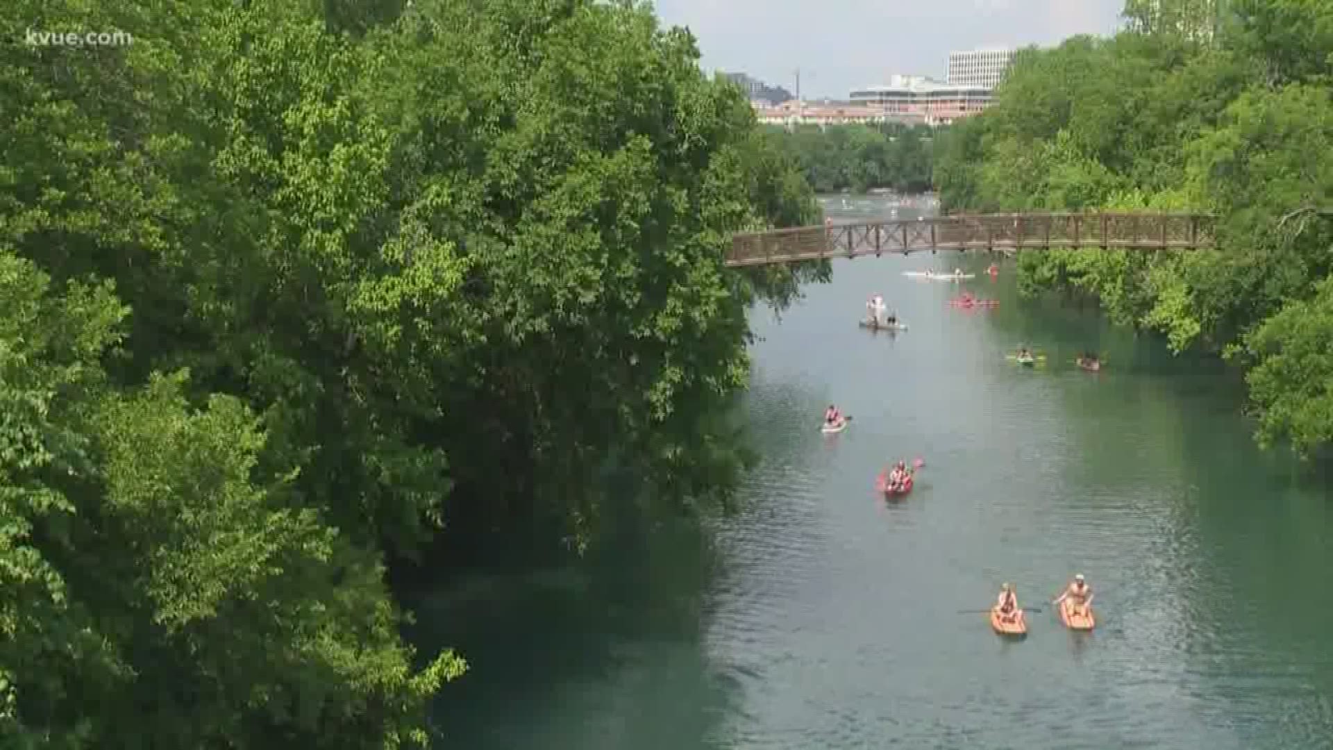 Woman jumps off pedestrian bridge, hits kayak