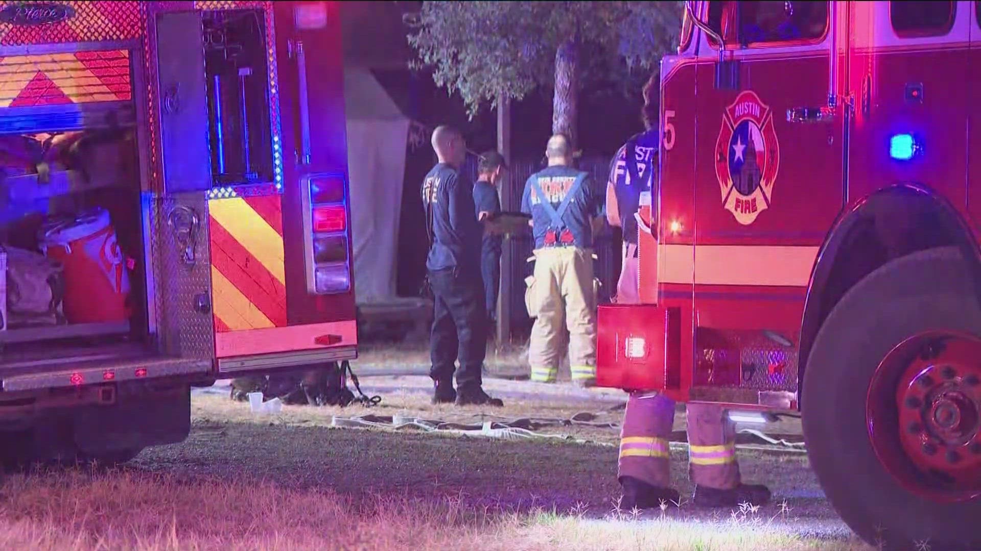 Austin firefighters got the fire on Dalton Lane under control, but not before it spread to grass and two parked cars nearby.