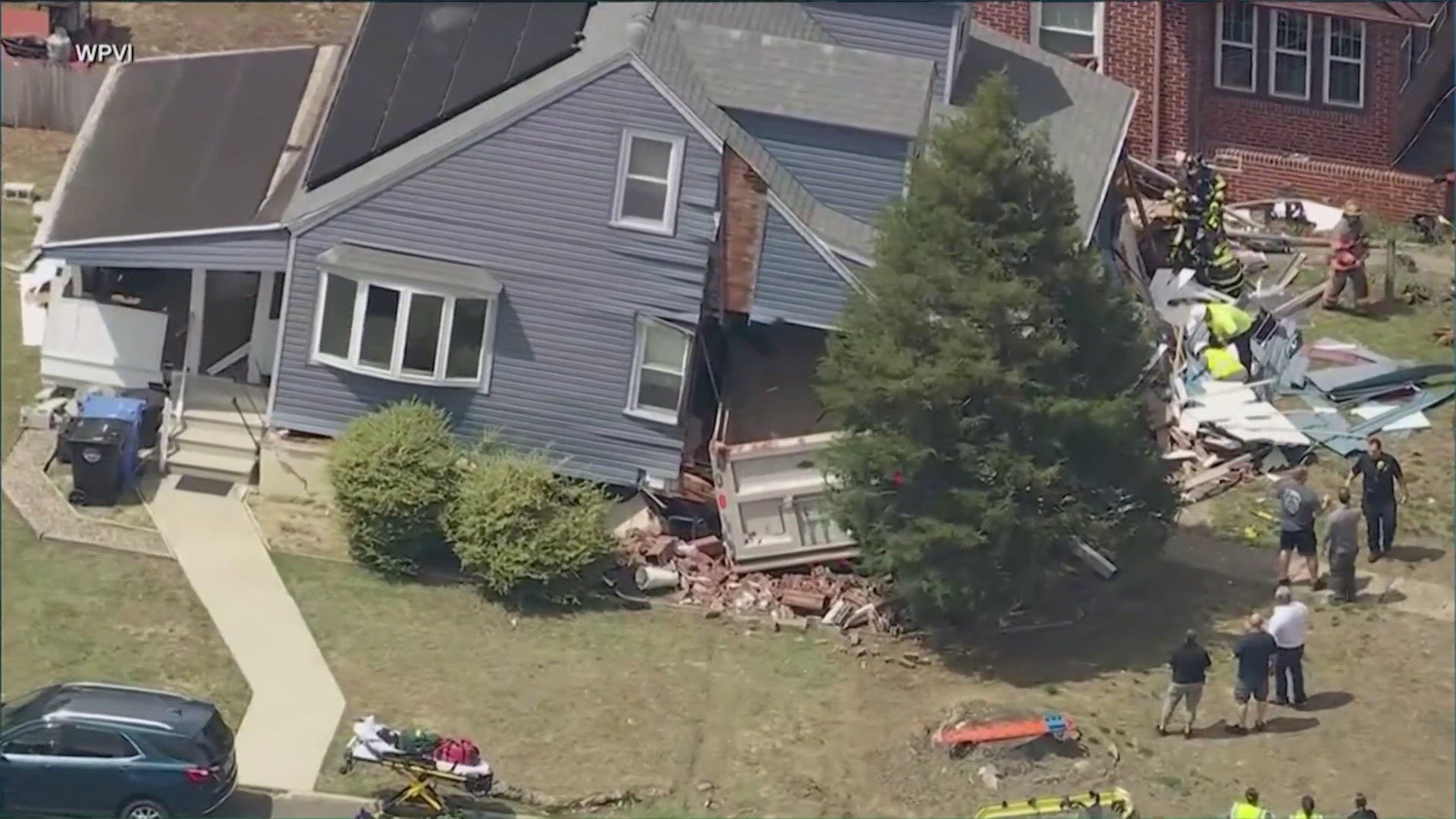 The 73,000-pound truck took down a utility pole before slamming into the house. The truck, which was carrying sand, ended up almost entirely inside the home.
