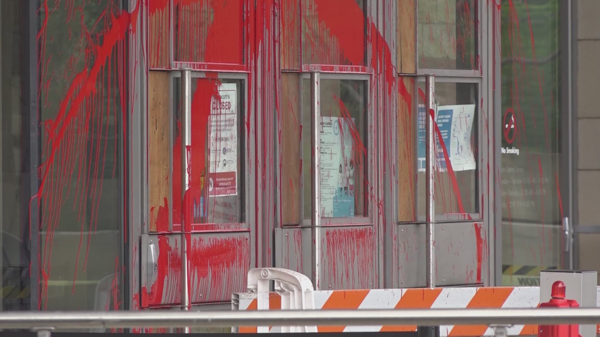 Vandals smeared red paint over its doors and windows.