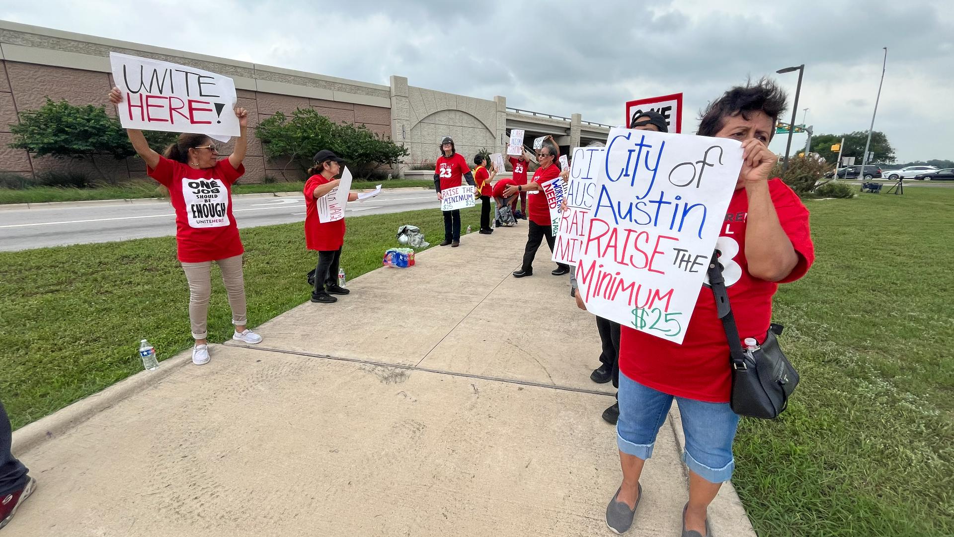 Food service and hospitality workers employed at Austin's airport through Delaware North picketed for a $25 per hour minimum wage.