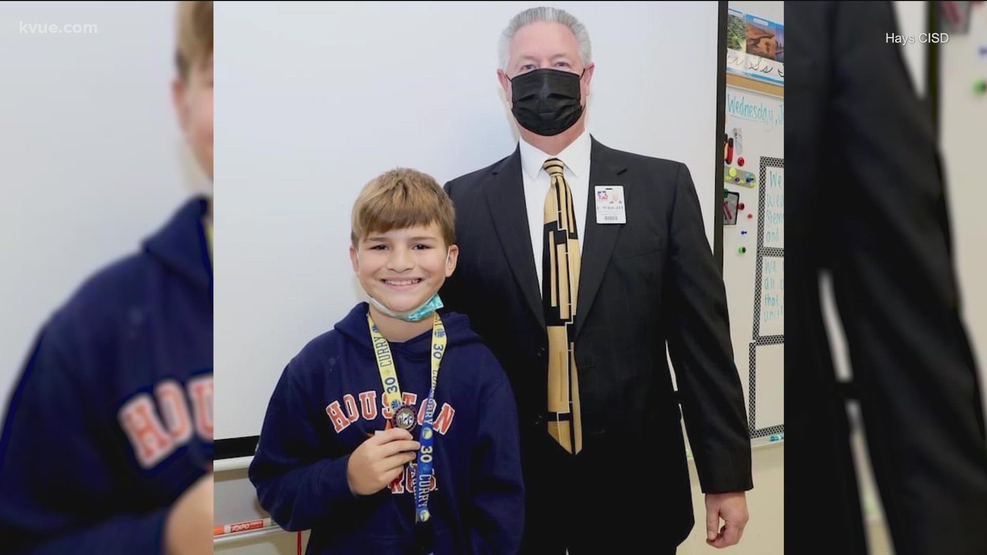 A Buda fourth-grader was honored for heroically saving his classmate's life.