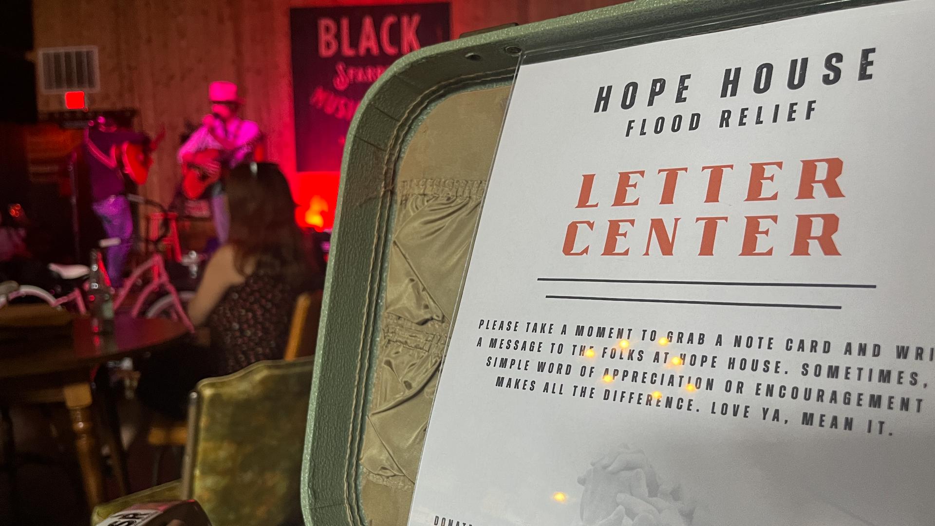 On Saturday, neighbors and supporters filled Black Sparrow Music Parlor in Taylor for a benefit concert and silent auction to help Hope House rebuild.