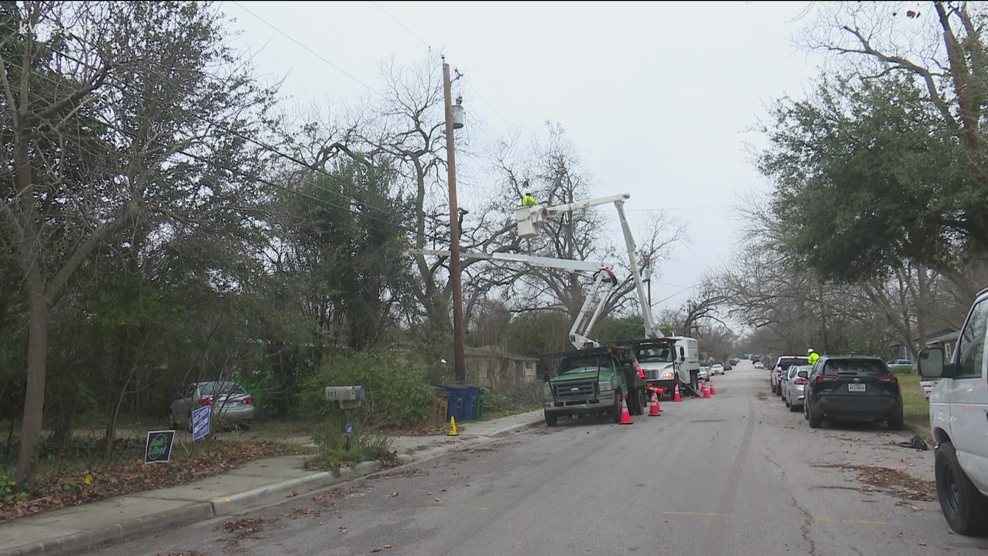 Austin energy crews prepared for the upcoming winter storm on Wednesday. Crews cleared tree limbs from power lines.