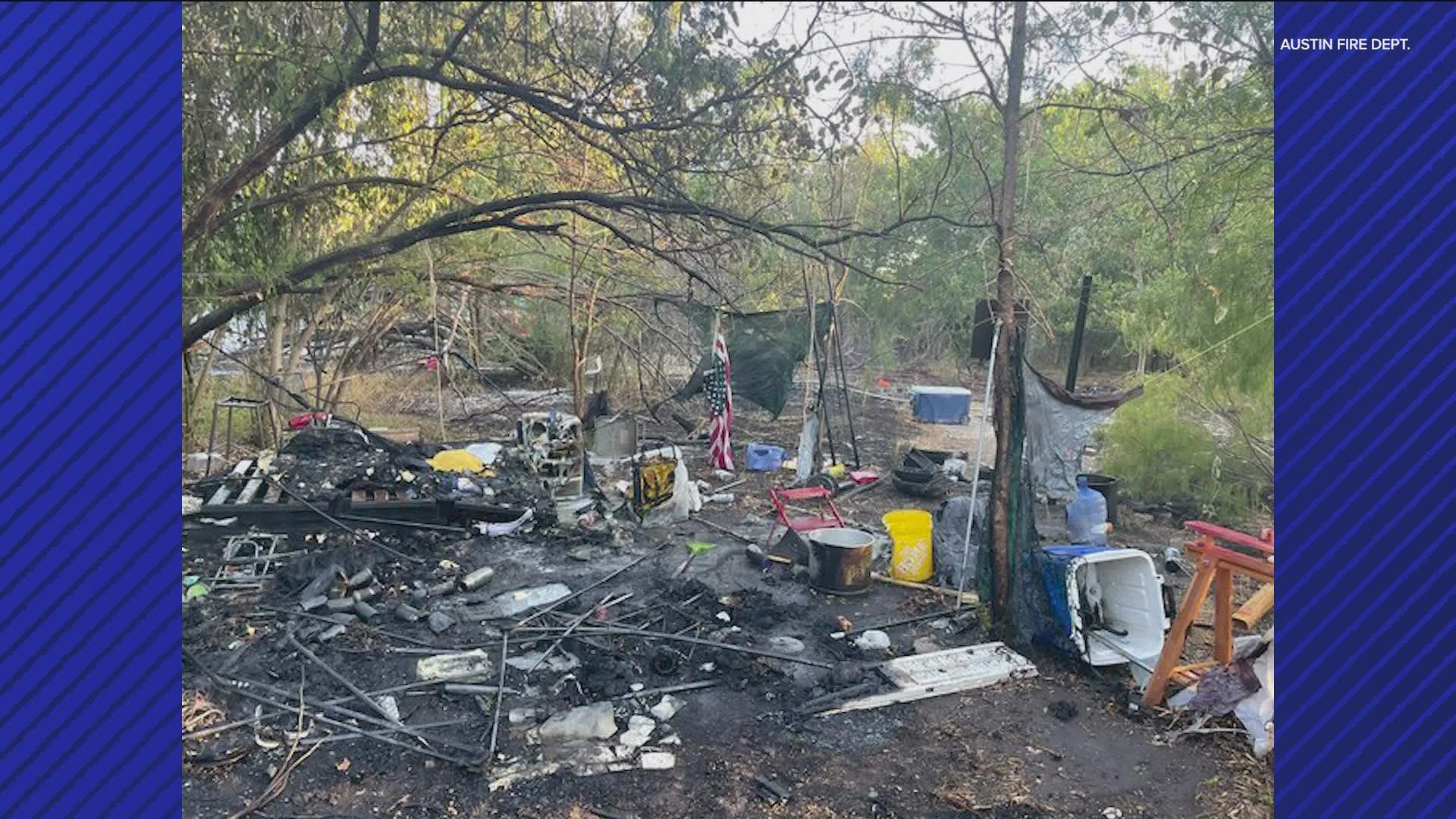 A fire in a South Austin neighborhood spread to propane tanks at an encampment in the woods late Monday night.