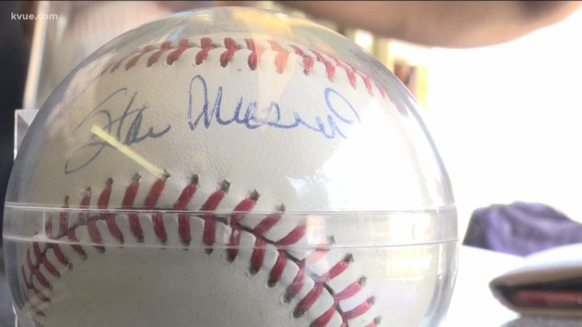 Austinite donates MLB baseball's to raise thousands of dollars for two local teams.