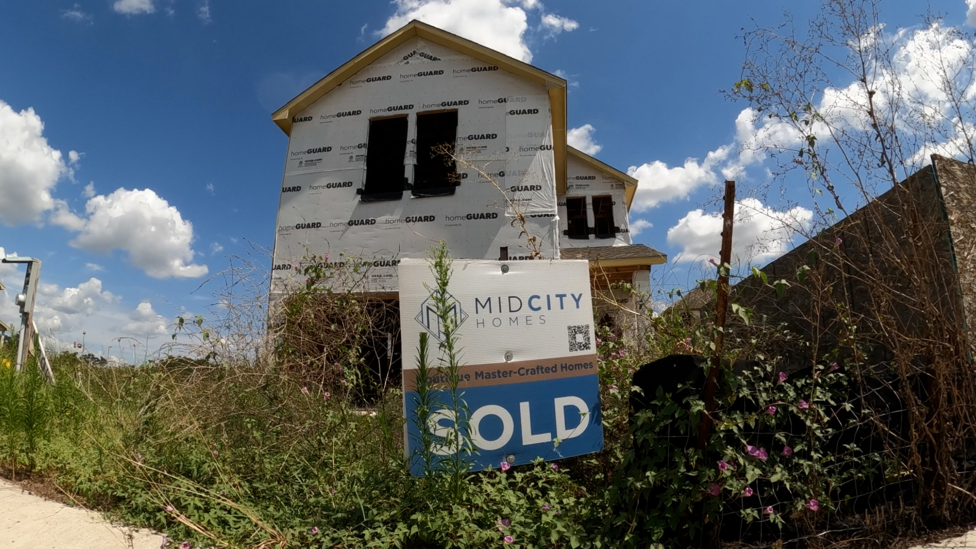 Neighbors near the subdivision in South Austin say more than a dozen homes have sat unfinished and vandalized for a year.