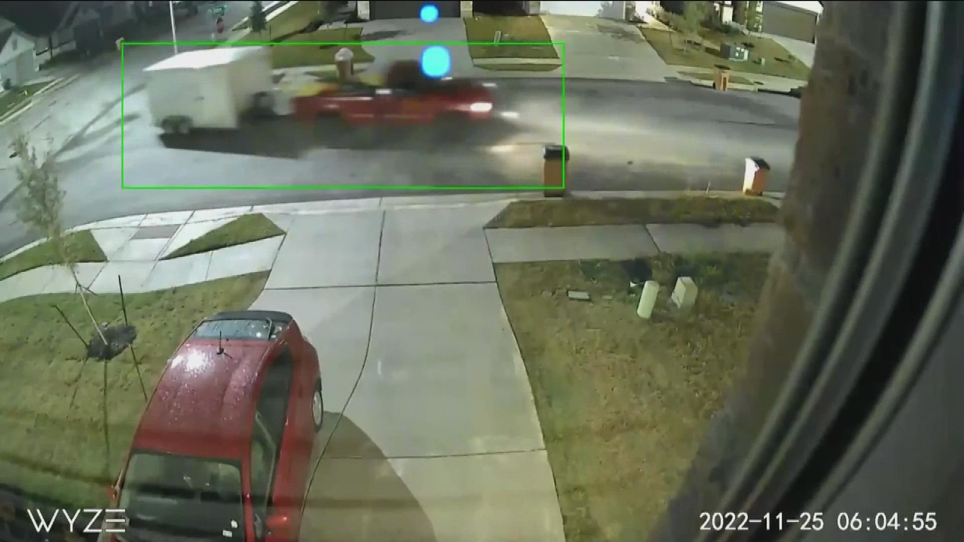 Surveillance video shows a red truck driving up, stopping directly next to the trailer, unhitching it from the band's van and driving away with the equipment.