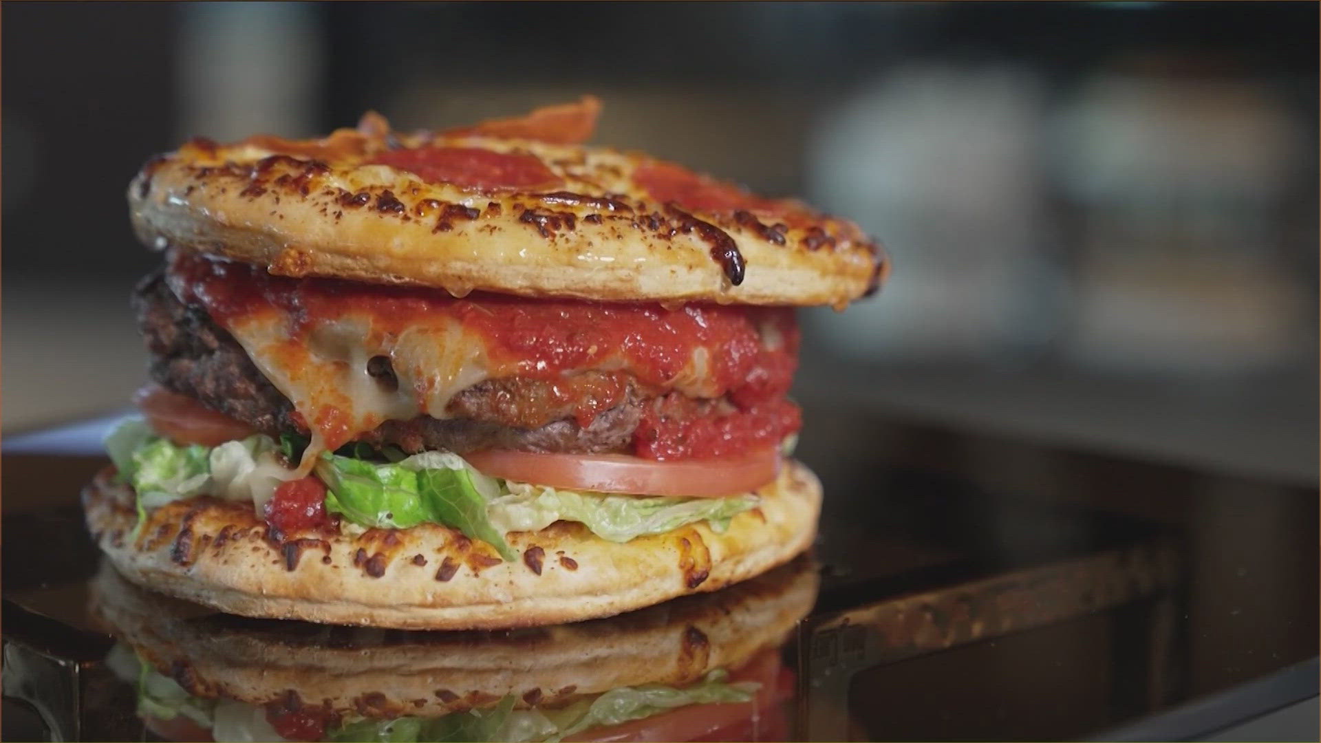 One of the headlining items that will be available during Dallas Cowboys games at AT&T Stadium this season is the "Pizza Burger."