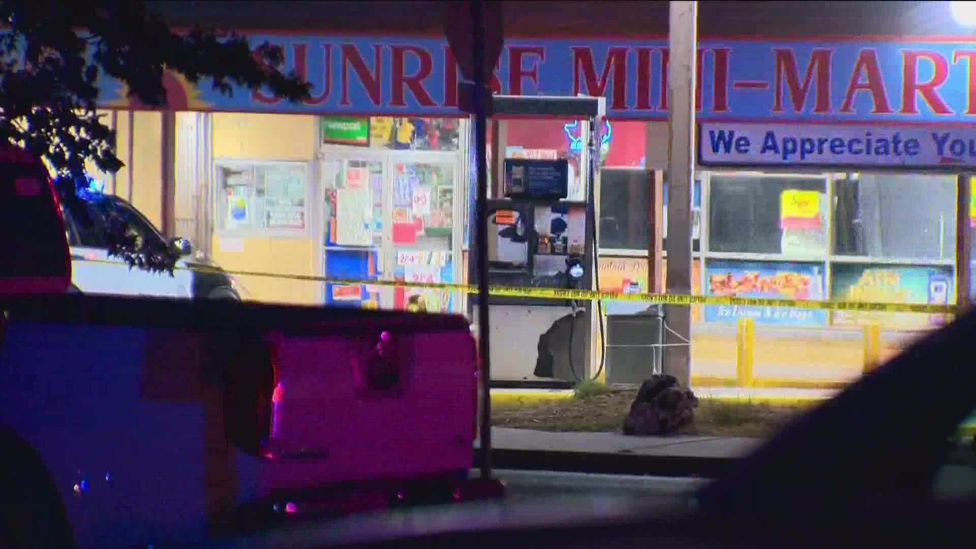 Police say two men were shot at a gas station near Georgian Drive and East Powell Lane.