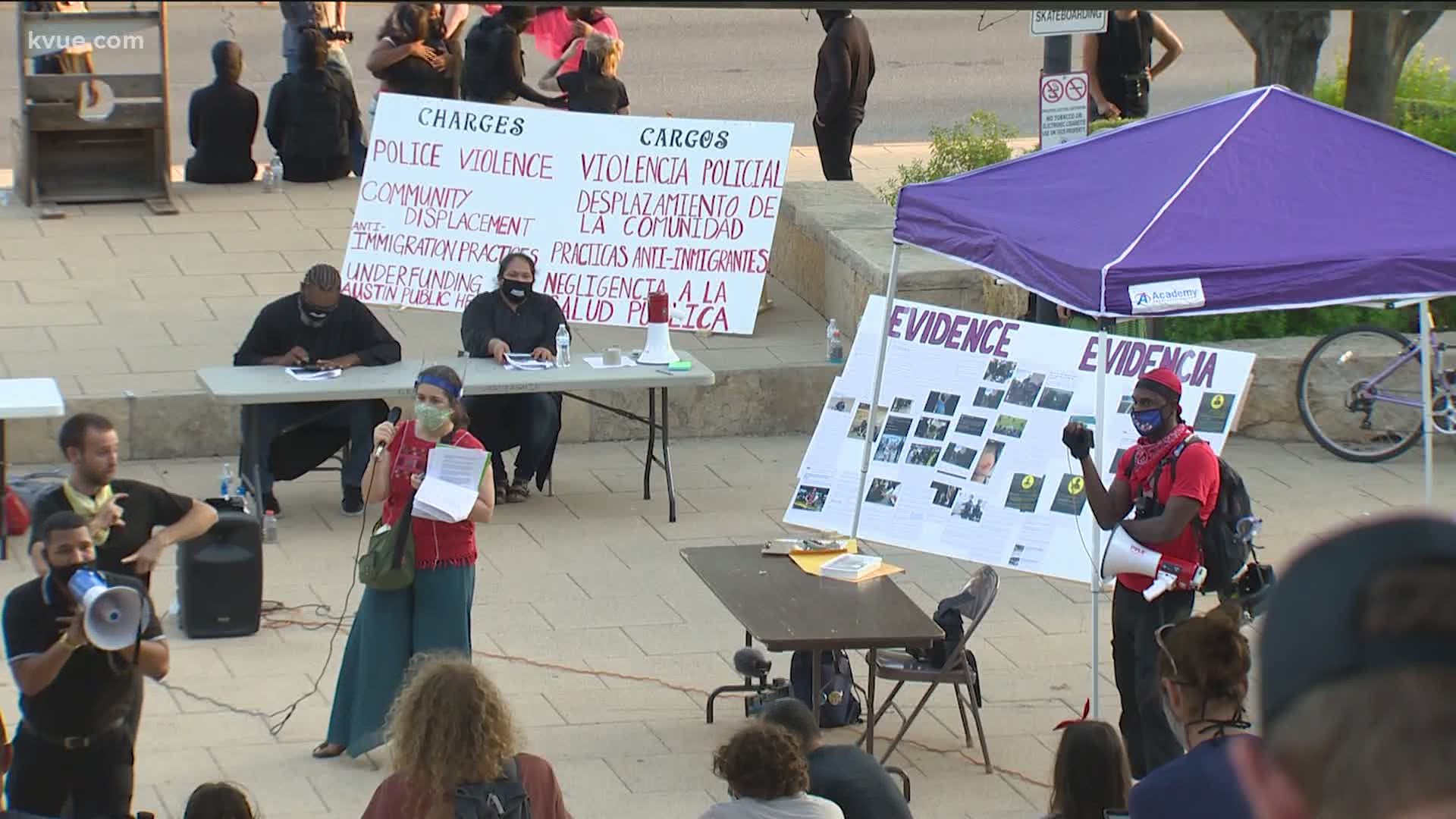 The calls for cutting the Austin Police Department budget continued on Saturday night. Demonstrators put City Council "on trial" in a mock display.