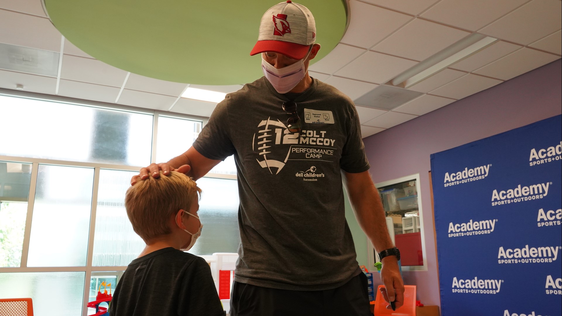 The legendary quarterback met kids receiving treatment and donated $1,500 worth of sports equipment.