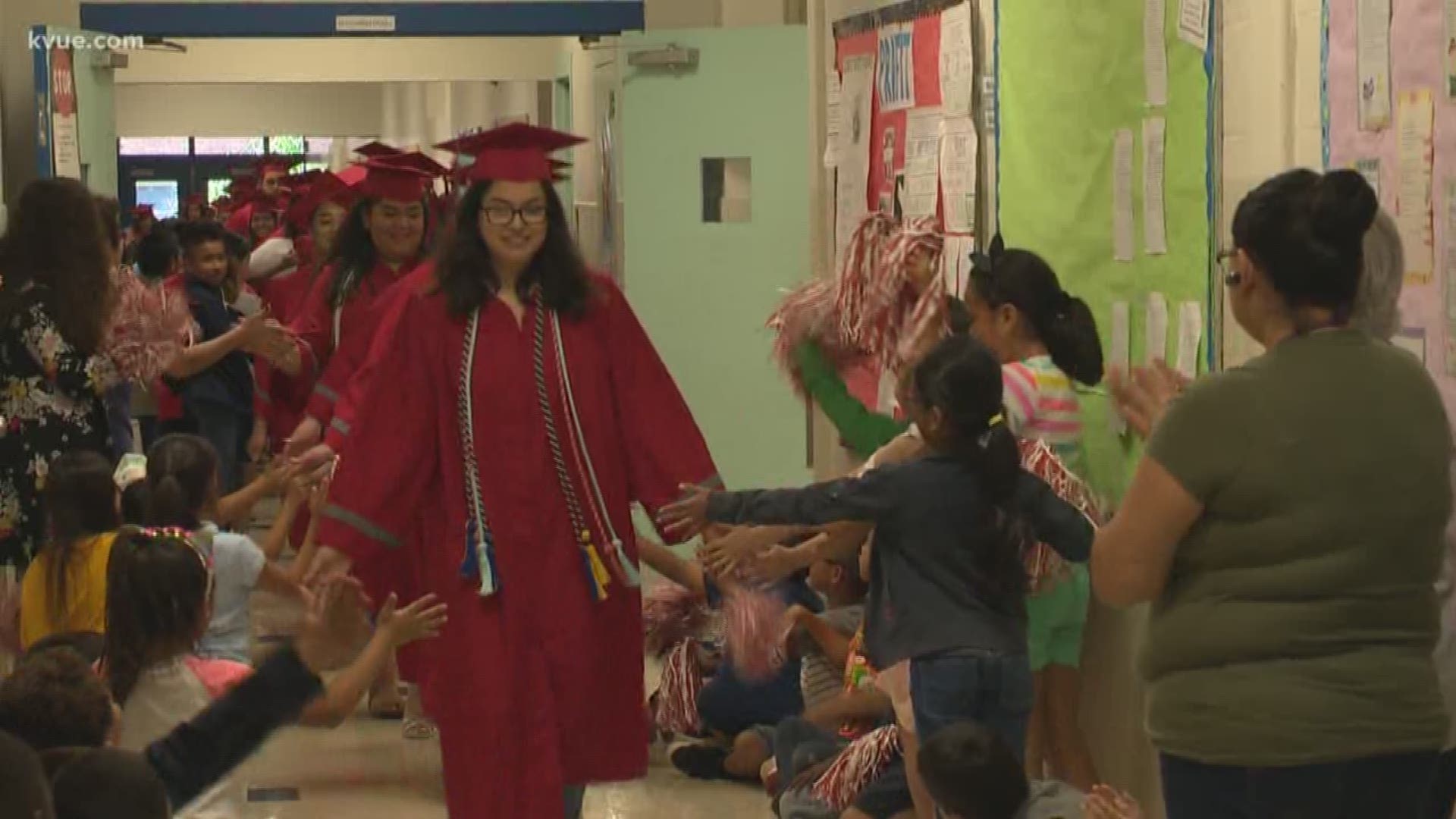 The high school seniors, who were dressed up in their caps and gowns, said they 'hope to inspire other kids to graduate.'