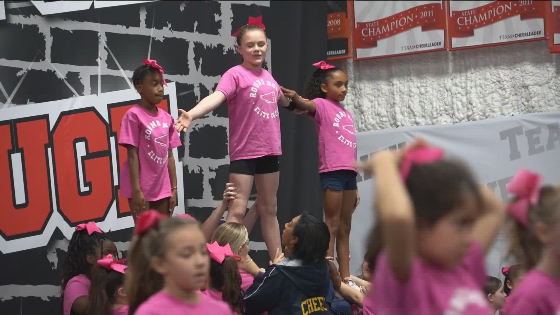 The girls at Round Rock Youth Elite Cheer are flipping into the new year with a goal. But they need the community's help.