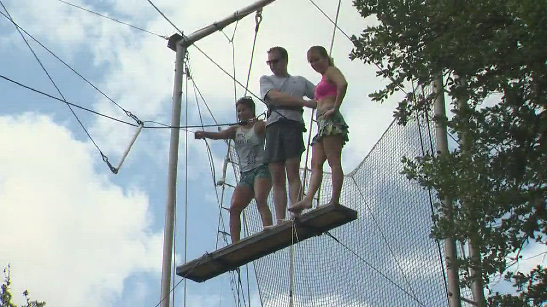 KVUE reporters Jay Wallis and Tony Plohetski stepped out of their comfort zones to give the flying trapeze a whirl with Circus of Hope in Austin.