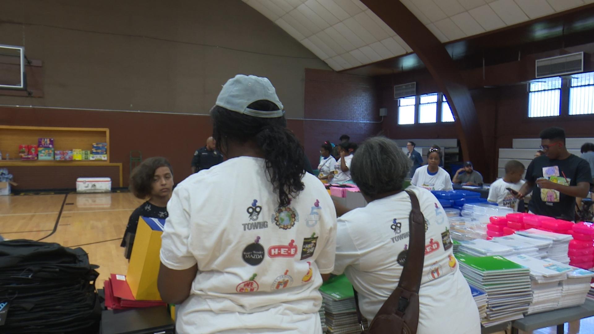 Kids could pick up backpacks, clothes, shoes, and get a free haircut. There was also food, drinks and games.