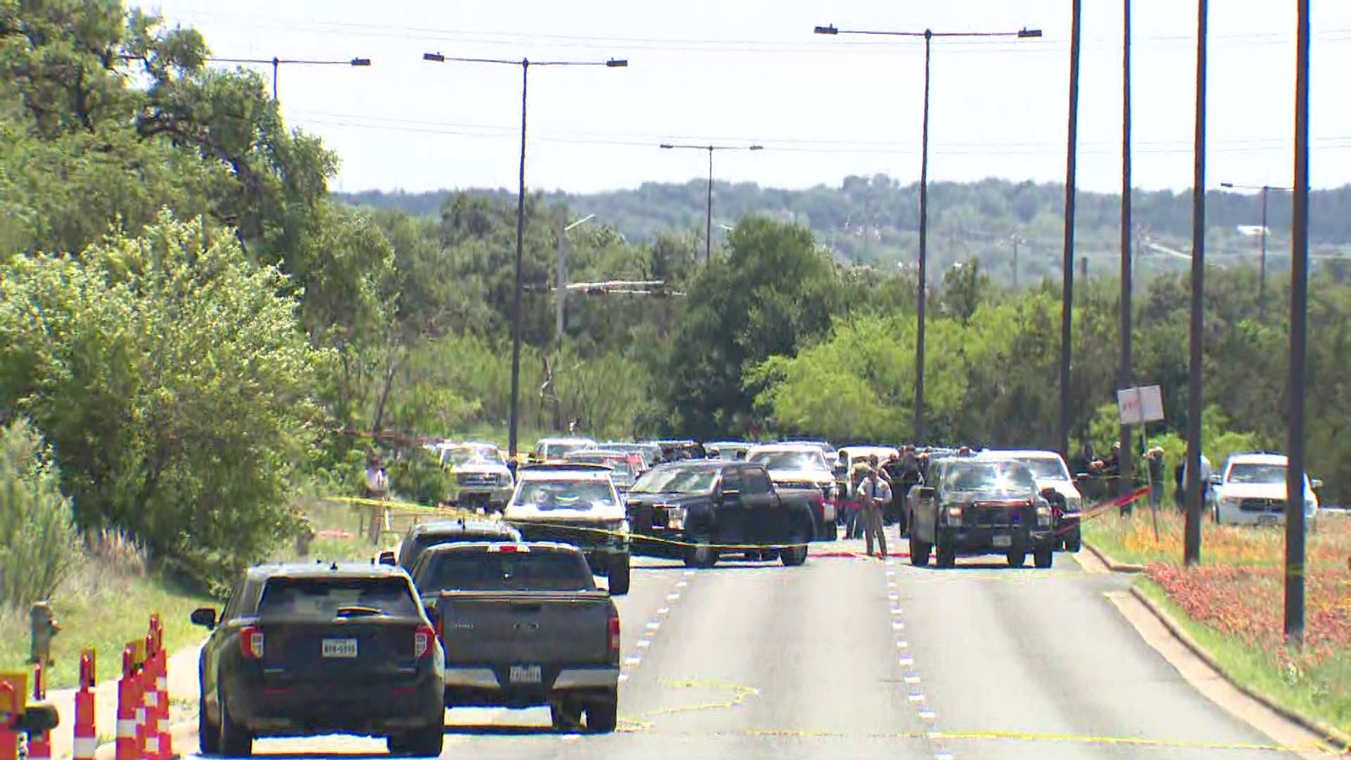 A suspect is dead after multiple members of the Lone Star Fugitive Task Force opened fire while attempting to serve a warrant, sources told KVUE.