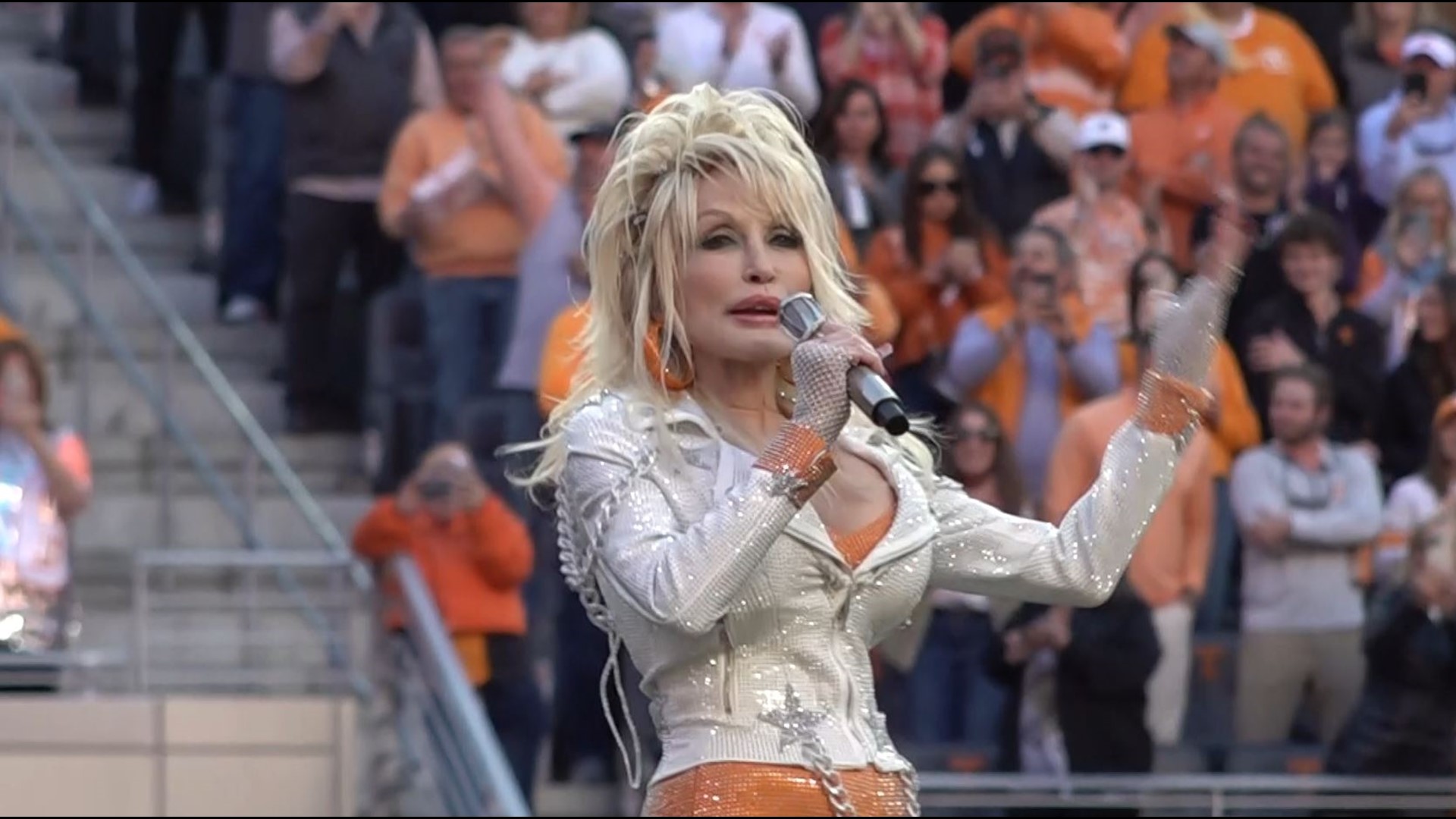 Dolly Parton was escorted onto the field by Peyton Manning.