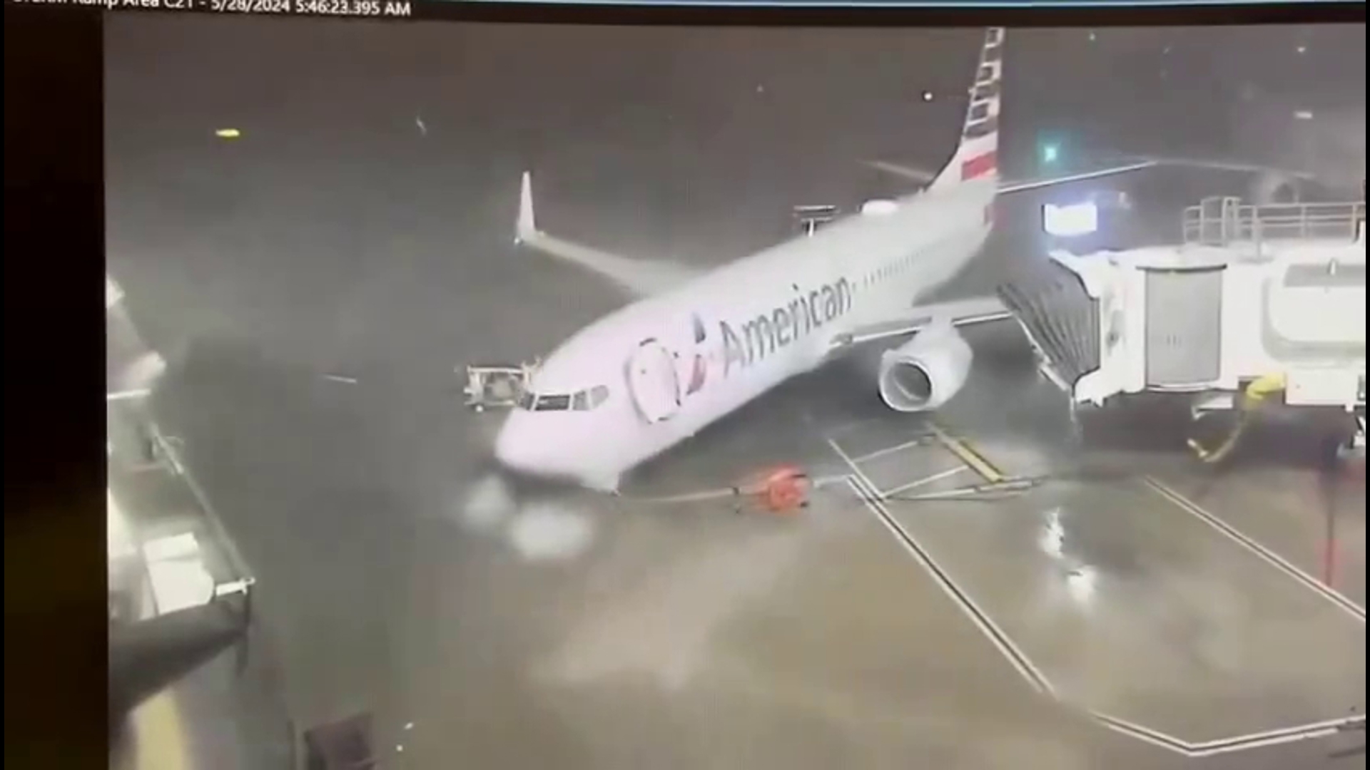 Strong winds push airplane away from gate at DFW Airport