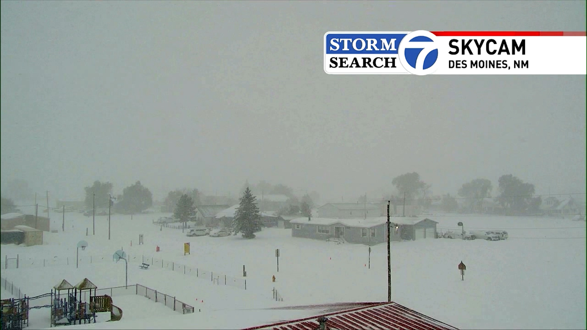 Skycam shows snow falling in Des Moines, New Mexico near the Texas border along the Panhandle.