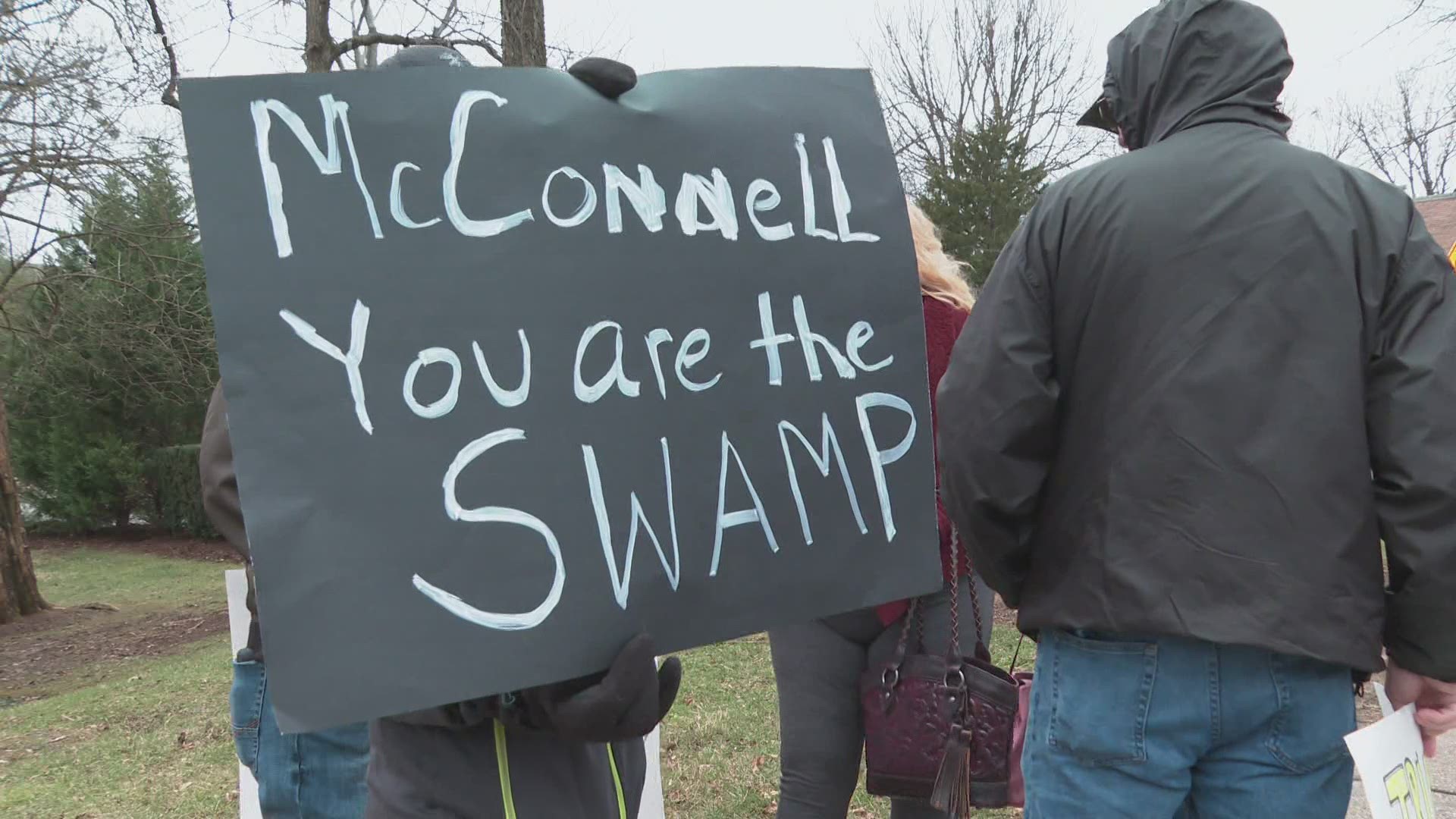 Hours after the front of his Highlands home was vandalized, protesters gathered to discuss the 2020 election and the stimulus bill.