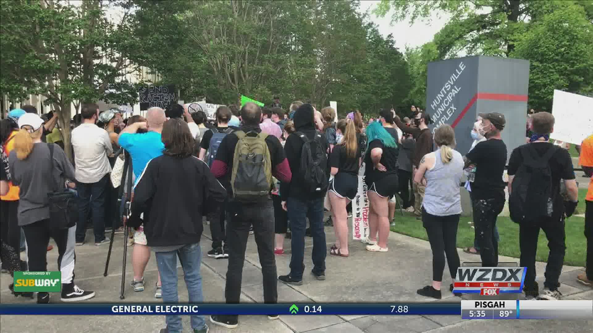 Protesters in downtown Huntsville met with Huntsville's District 2 Council Rep. Frances Akridge to ask for apologies and changes.